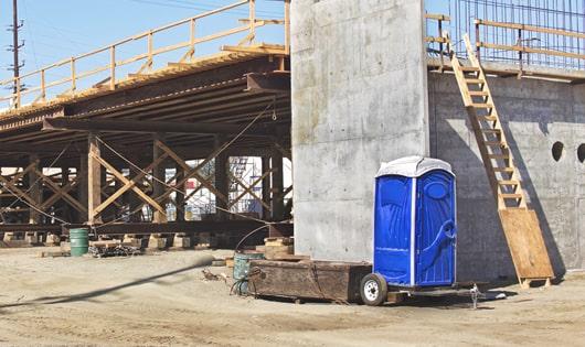 multiple portable toilets arranged for easy access at a job site